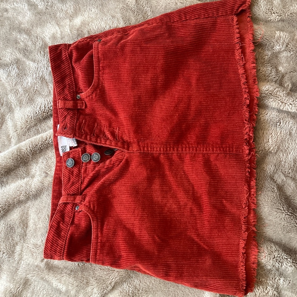 Orange corduroy mini skirt.